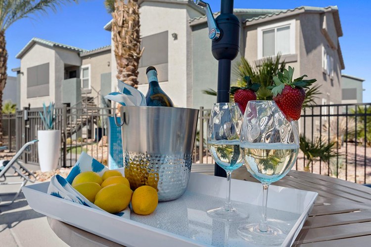 Enjoy a drink and a snack at one of our poolside tables.