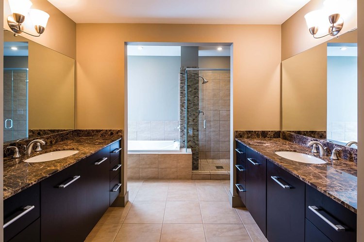 Master bathrooms feature both a deep soaking tub and walk-in shower