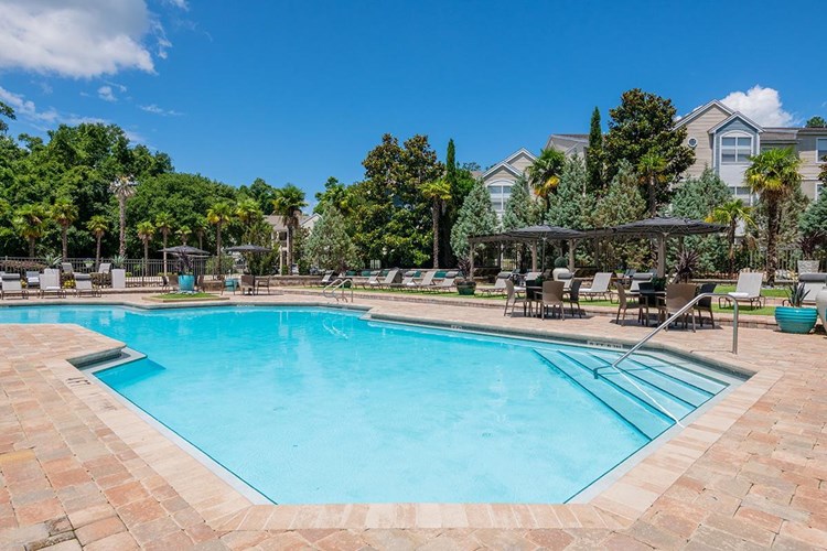 Sparkling resort-style swimming pool with expansive sundeck featuring plenty of loungers for you to take in the Florida sun!