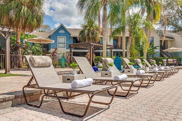 Relax by the pool in one of our loungers and enjoy beautiful Naples lake views.