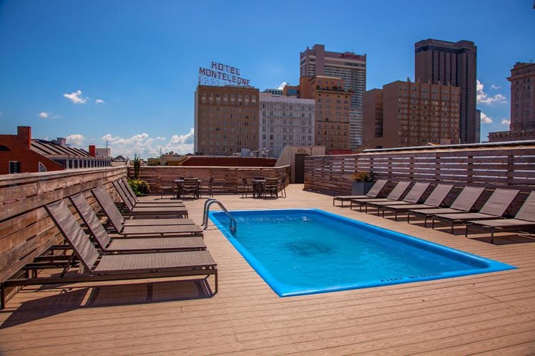 Lounge Chairs Overlooking Rooftop Pool and Downtown New Orleans