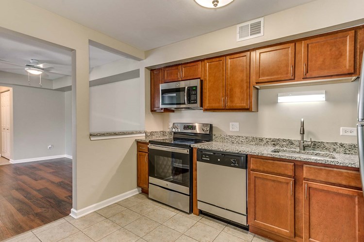 Spacious kitchen with stainless steel appliances and granite countertops