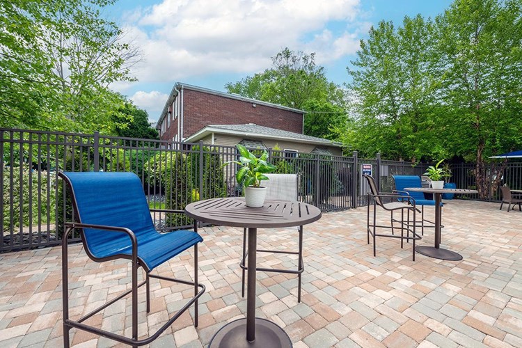 Our expansive sundeck features plenty of poolside tables and a gas grill.