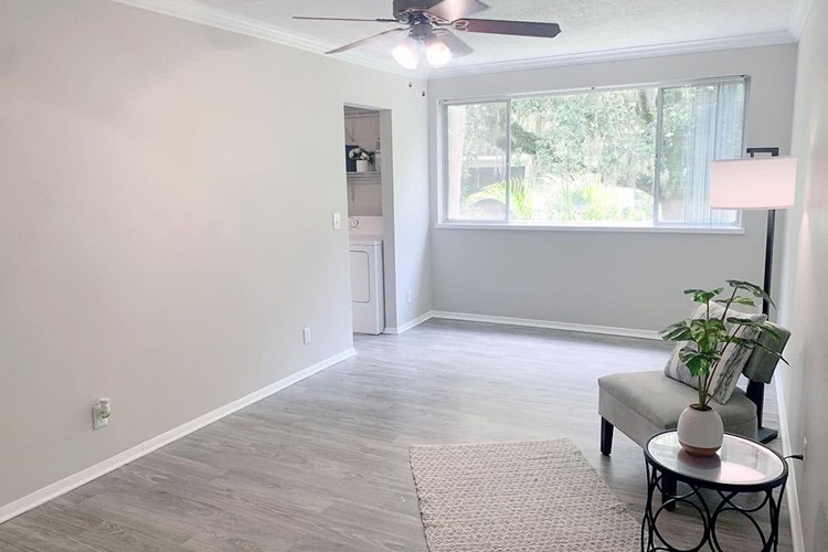 Our studio apartment homes feature spacious living areas with a ceiling fan.