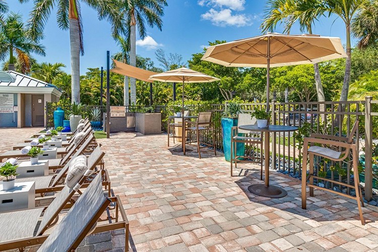 Our expansive sundeck features plenty of tables with umbrellas as well as a gas grill so you can cook out by the pool.
