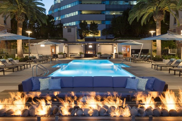 Swimming Pool and Sundeck with Outdoor Fire Pit and Lounge Seating