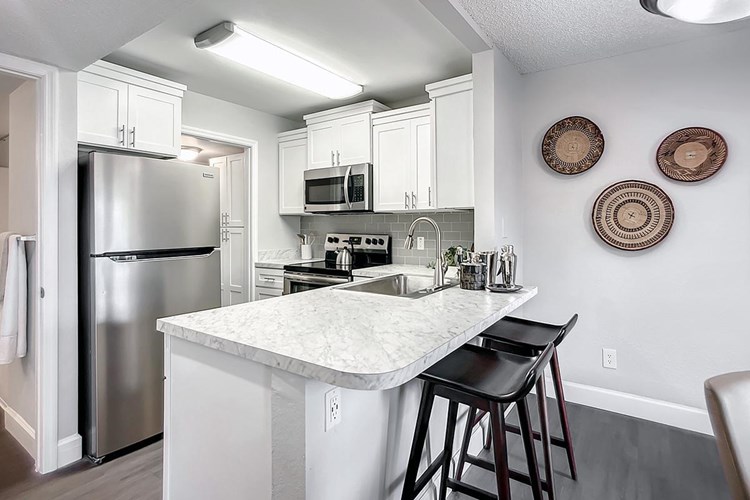 Our newly renovated homes feature gourmet kitchens with a breakfast bar.