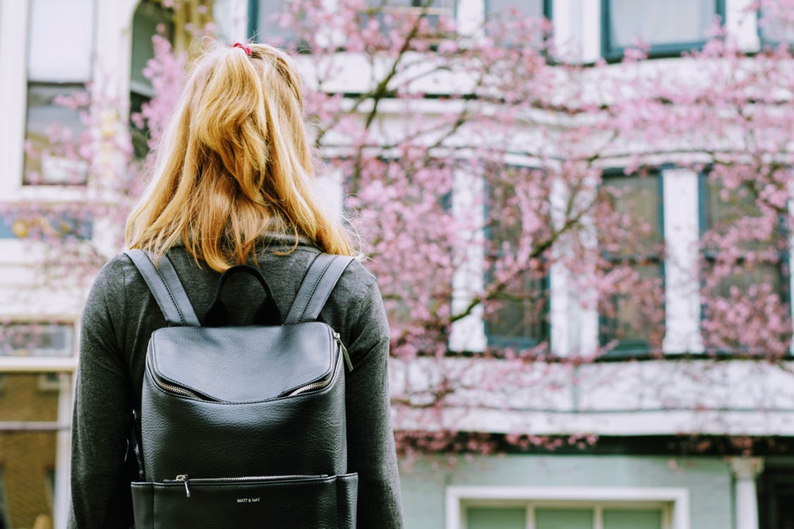 Girl Standing Facing Trees