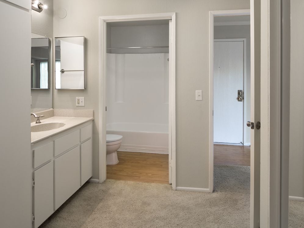 Classic Package I bath with beige laminate countertops and white cabinetry