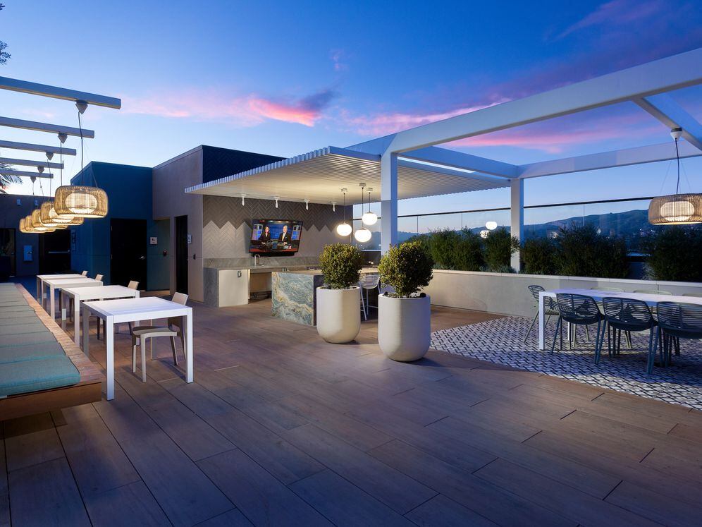 Building A rooftop lounge with entertaining kitchen and seating