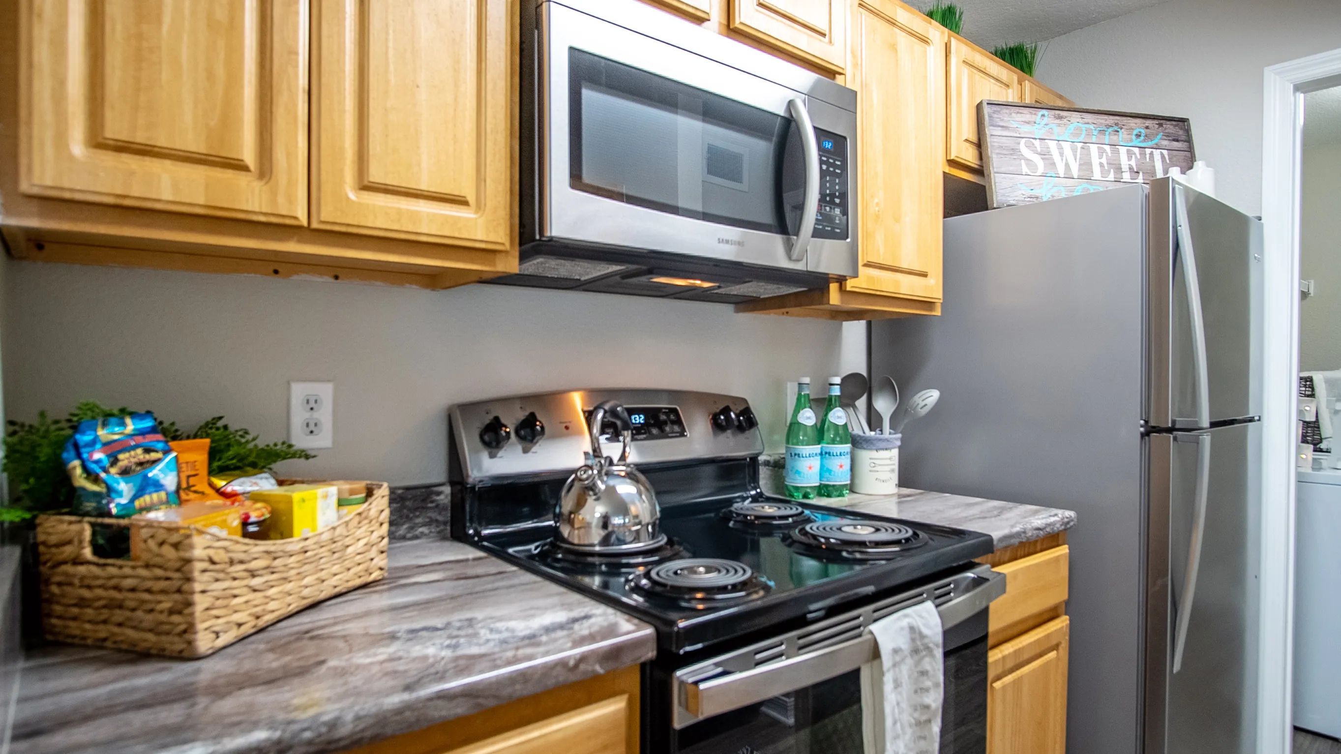 Sizzle and serve in the signature kitchen at Eagle's Pointe. Stainless steel appliances and stunning black fusion countertops create room for a culinary masterpiece.