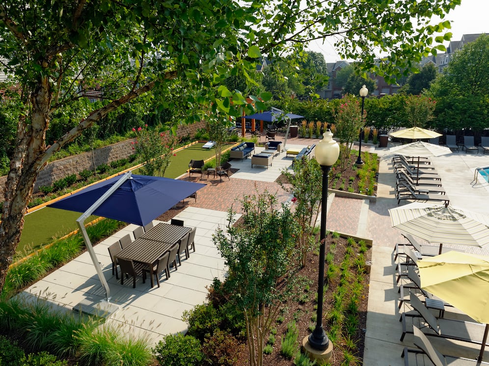 Courtyard with dining area, lounge seating and outdoor gaming area