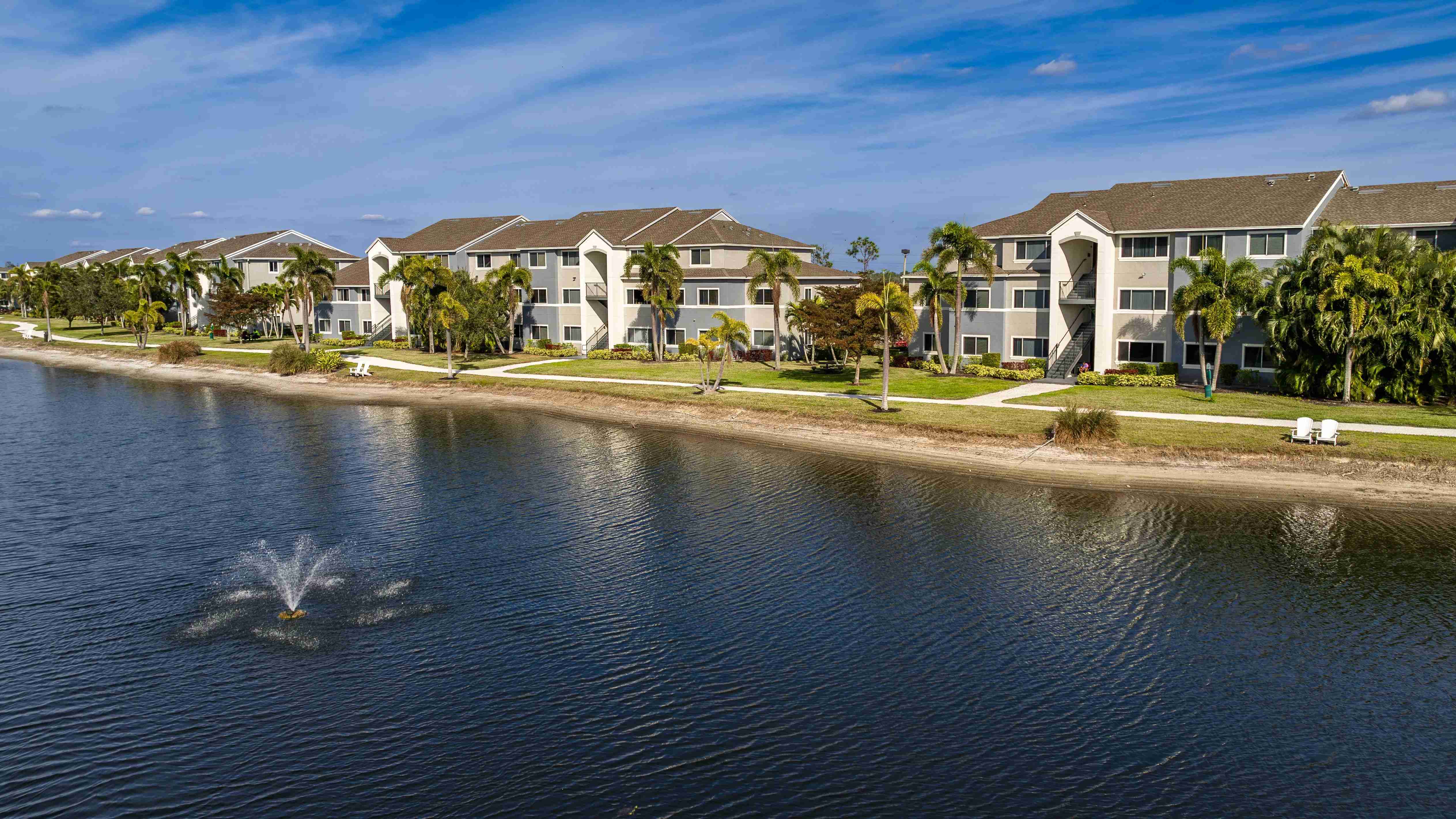Discover the beauty of lakeside living at Lexington Palms, featuring stunning exteriors and a relaxing atmosphere.
