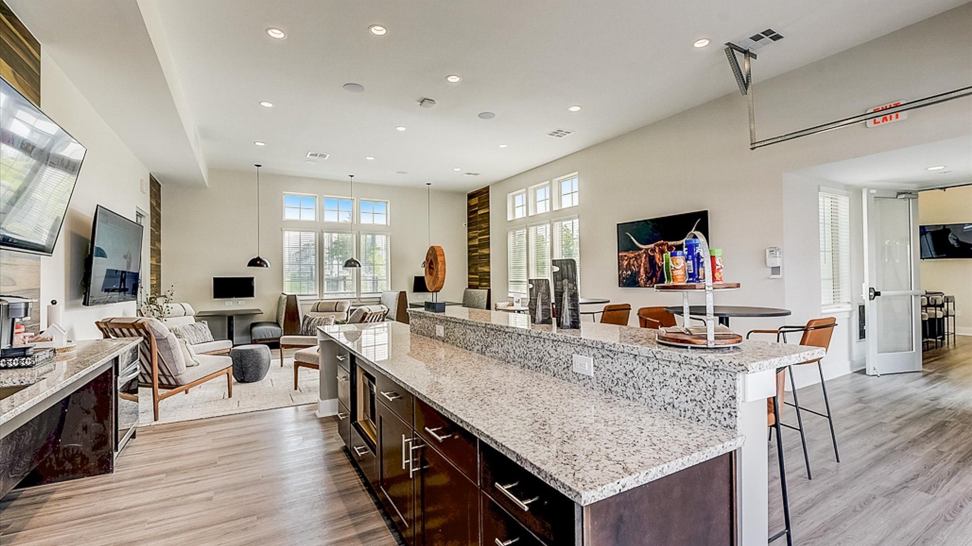 Open and airy community lounge with pool views