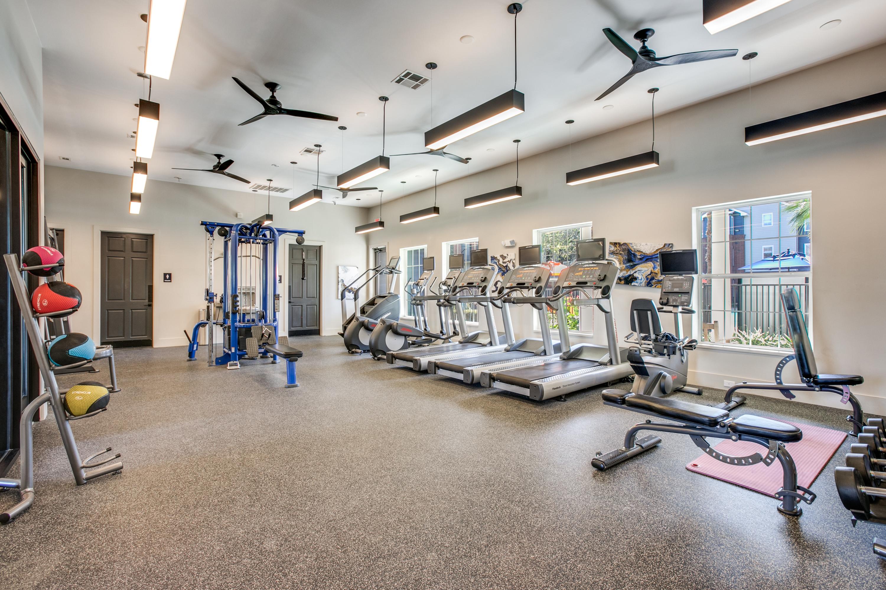 Fitness Center with treadmills, ellipticals,, and free weights.