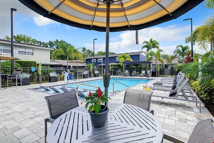 Our expansive sundeck includes plenty of poolside seating including tables with umbrellas.