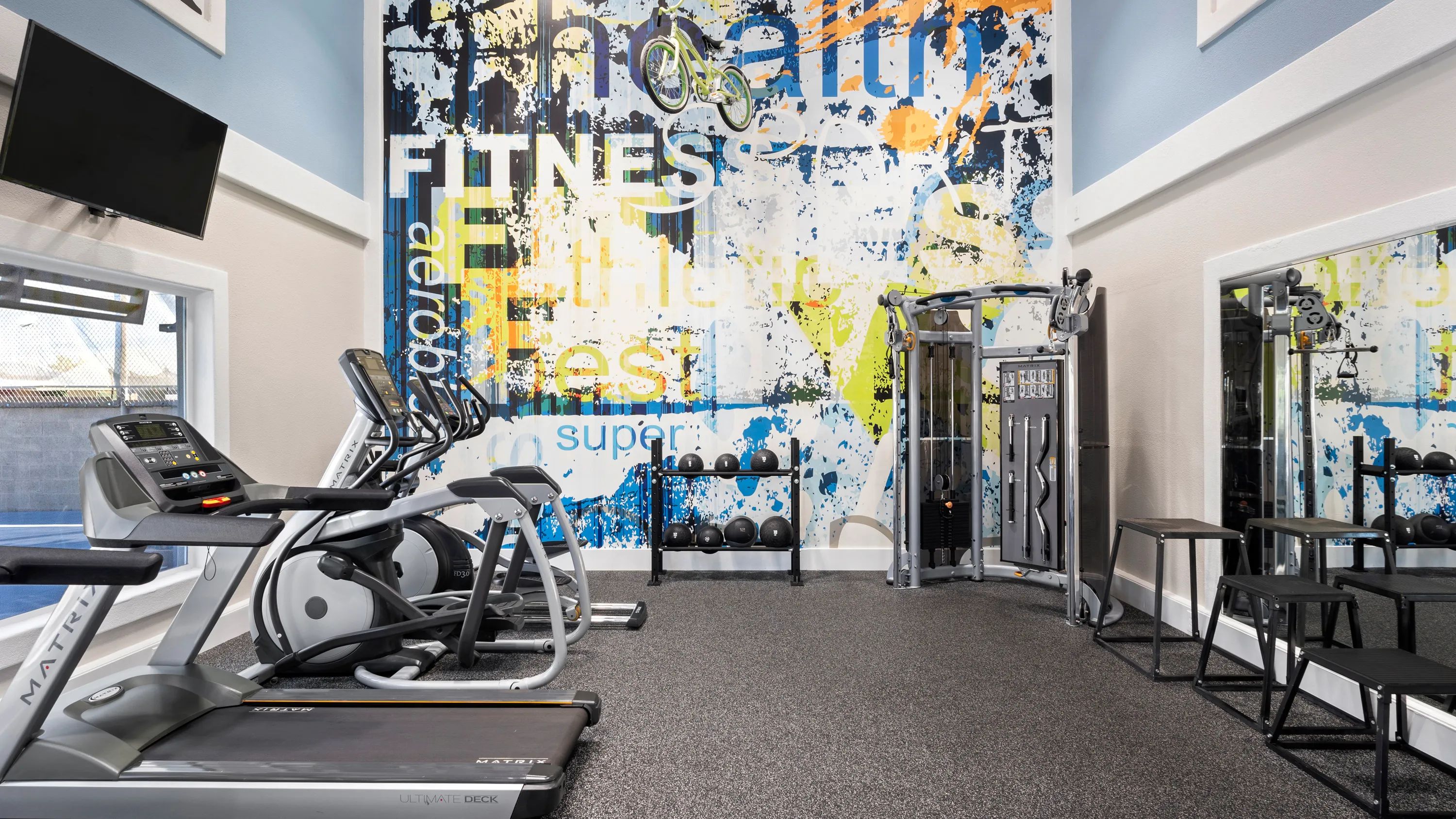 Mirrors help keep your form in check in our expansive fitness center. 
