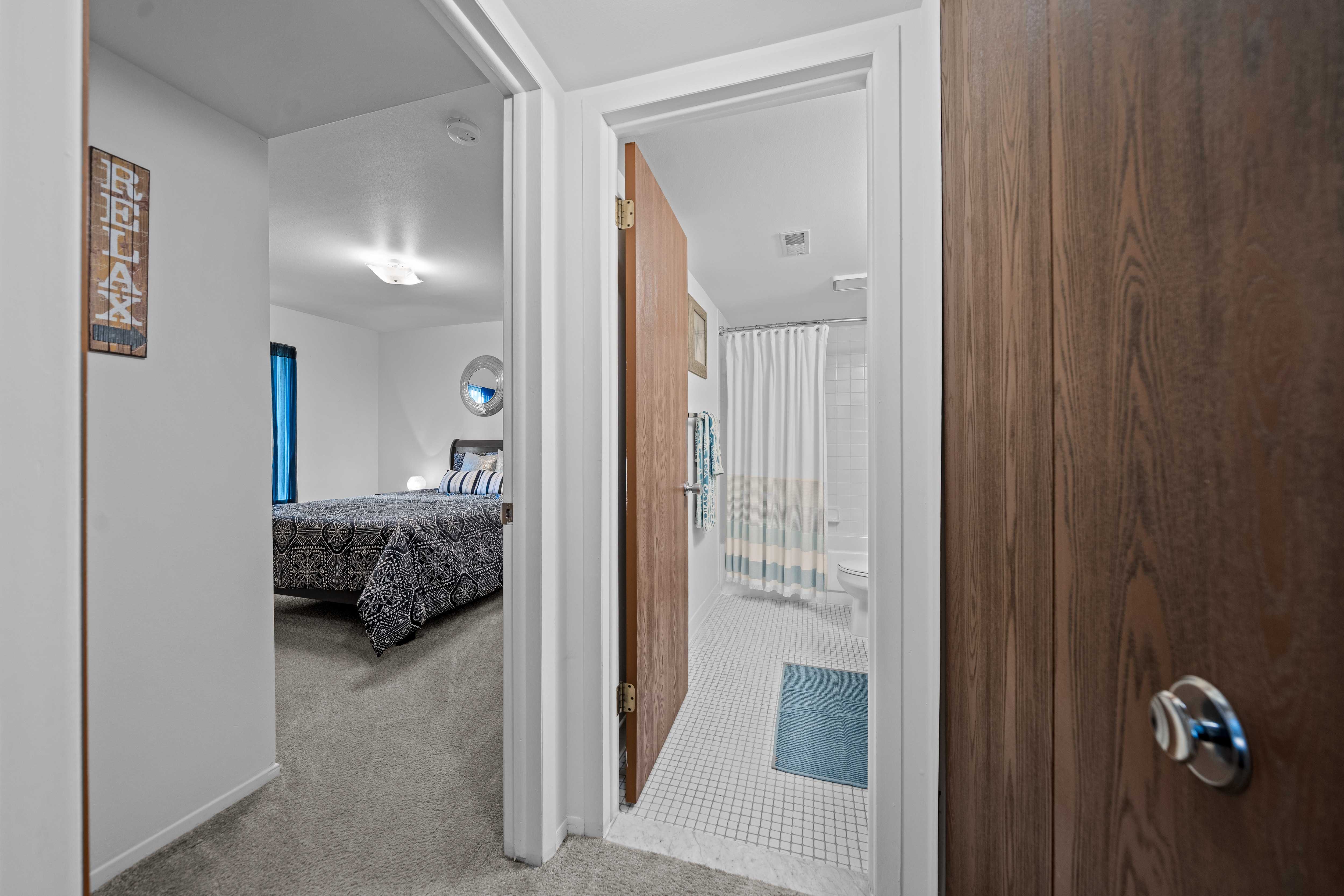 Bedroom/bathroom at Westwood Village Apartments in Westland, MI