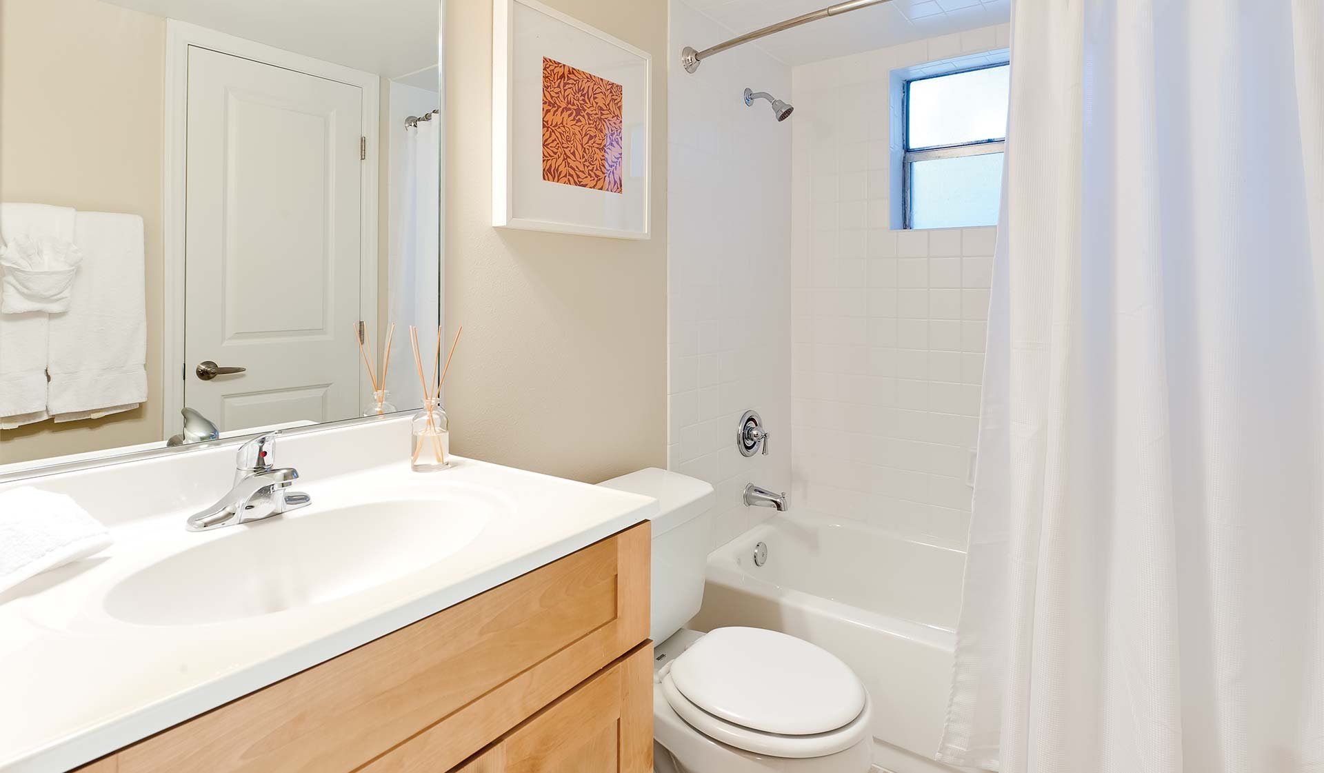 Bathrooms feature large cabinetry and great lighting