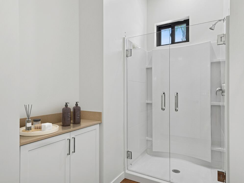 Coming Soon: Freestanding Home bath with beige quartz countertop and white cabinetry