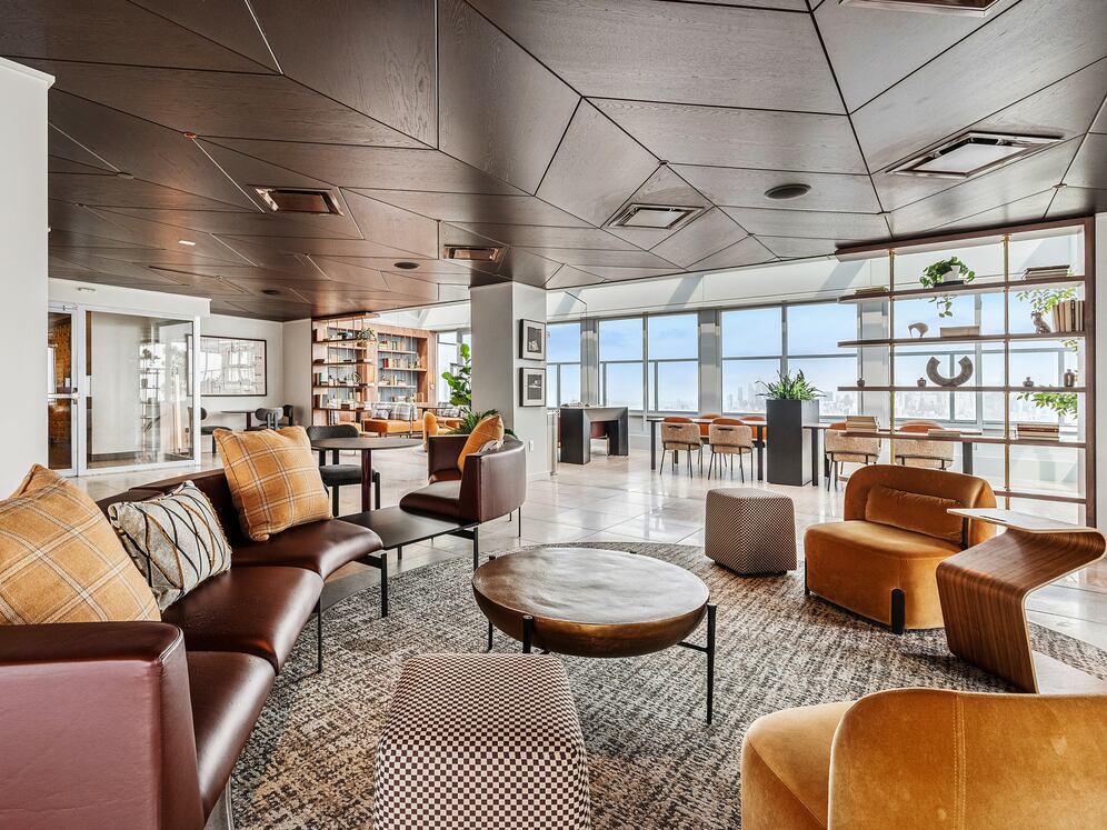 Rooftop lounge with ample seating and coworking spaces