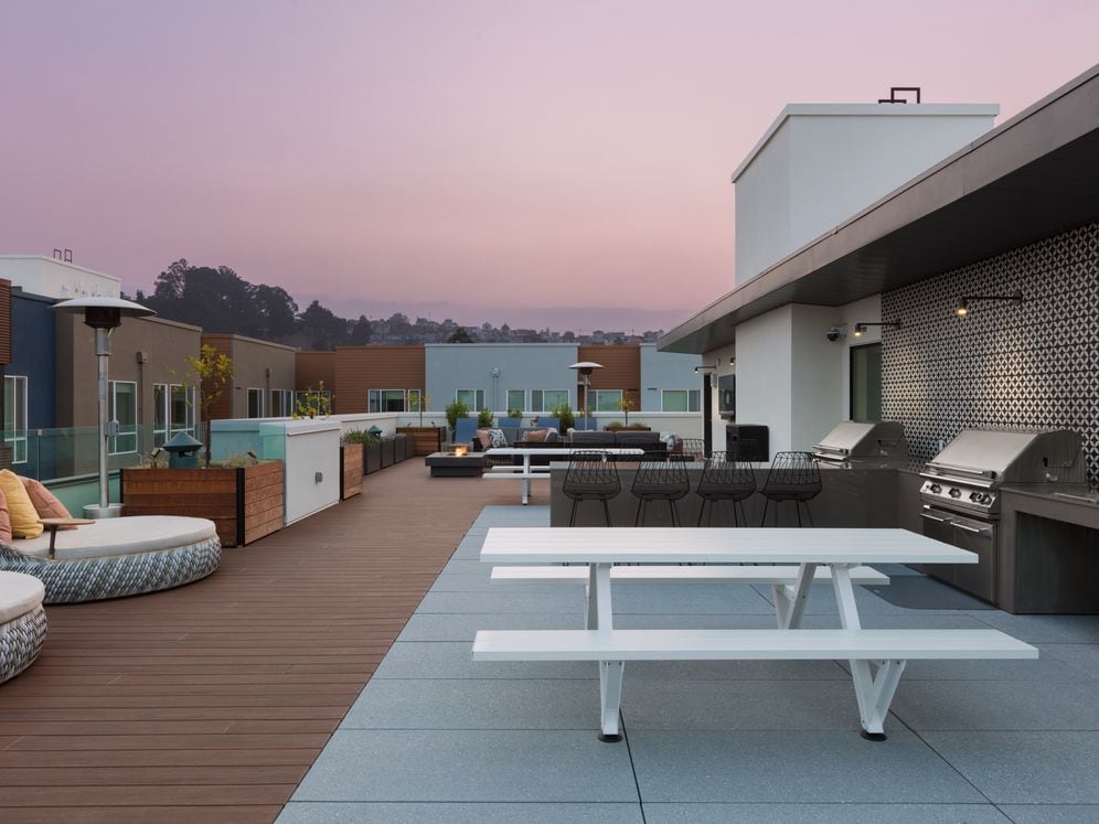 Rooftop deck with barbecue grills and common area seating
