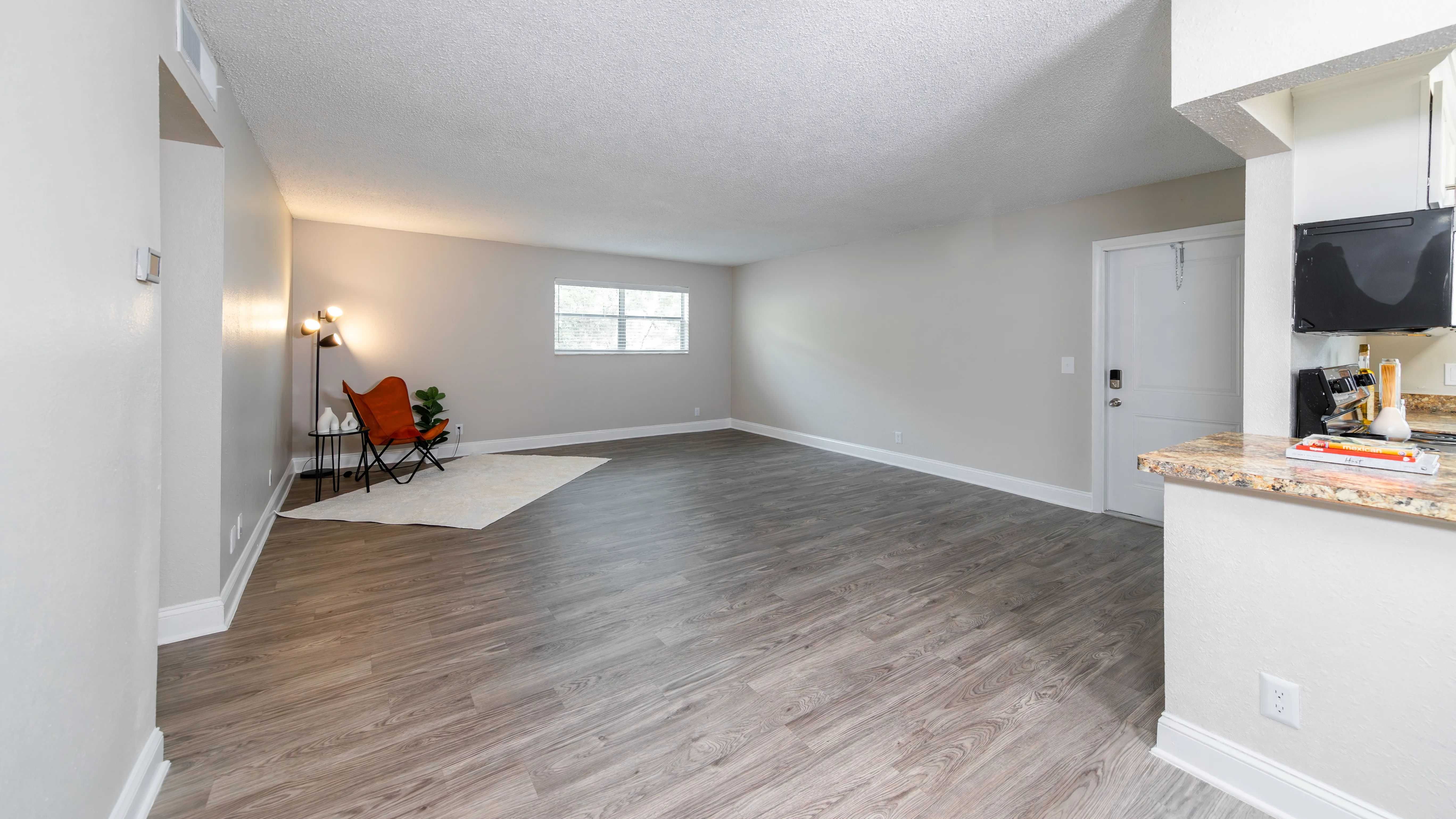 Kick back and relax in spacious living rooms with sleek wood-style floors.