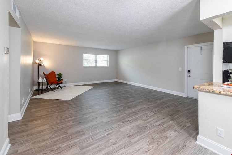 Kick back and relax in spacious living rooms with sleek wood-style floors.