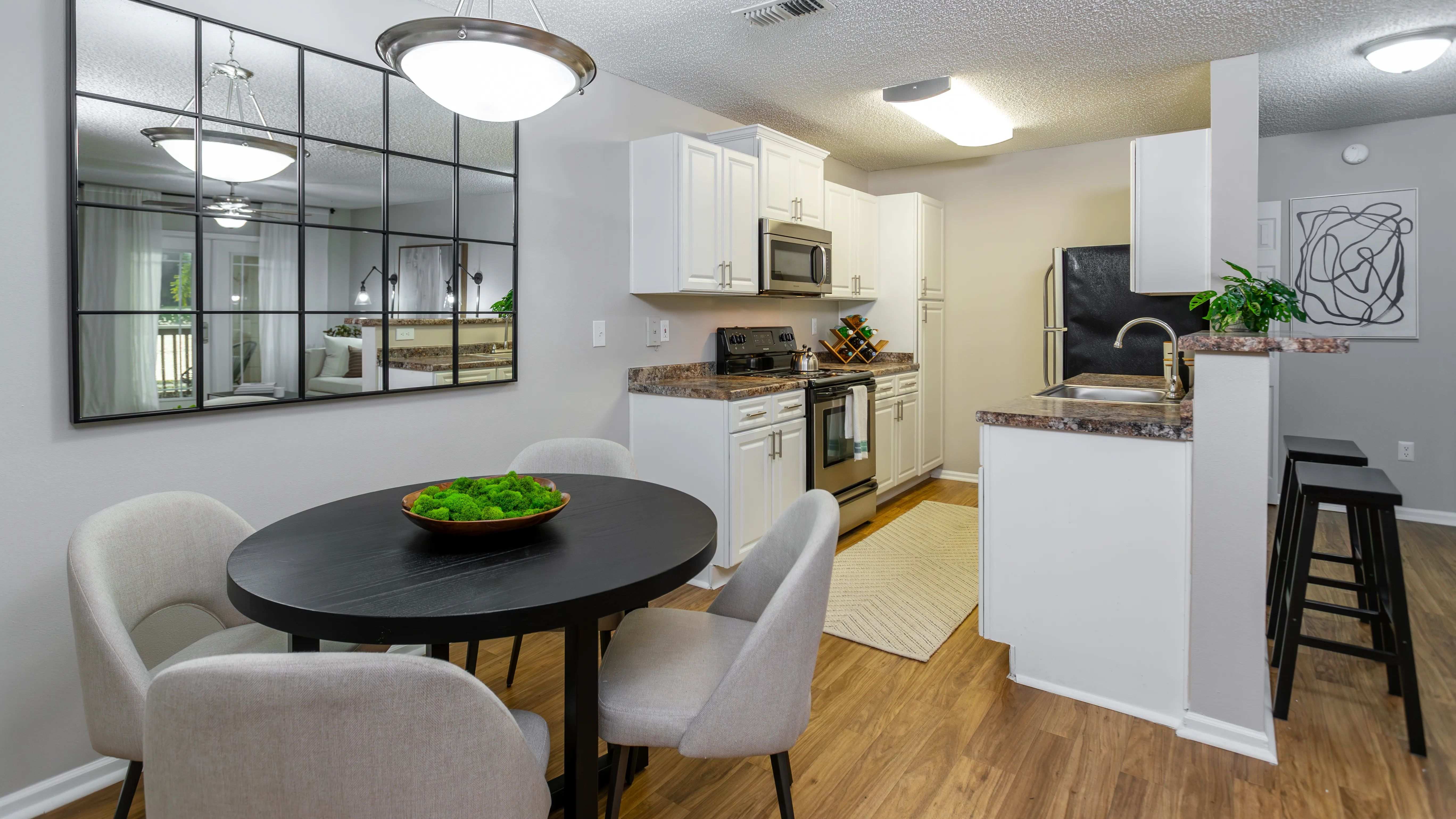 From meal prep to dinner parties, this open-concept kitchen and dining area offers both functionality and style with a spacious layout and contemporary design.