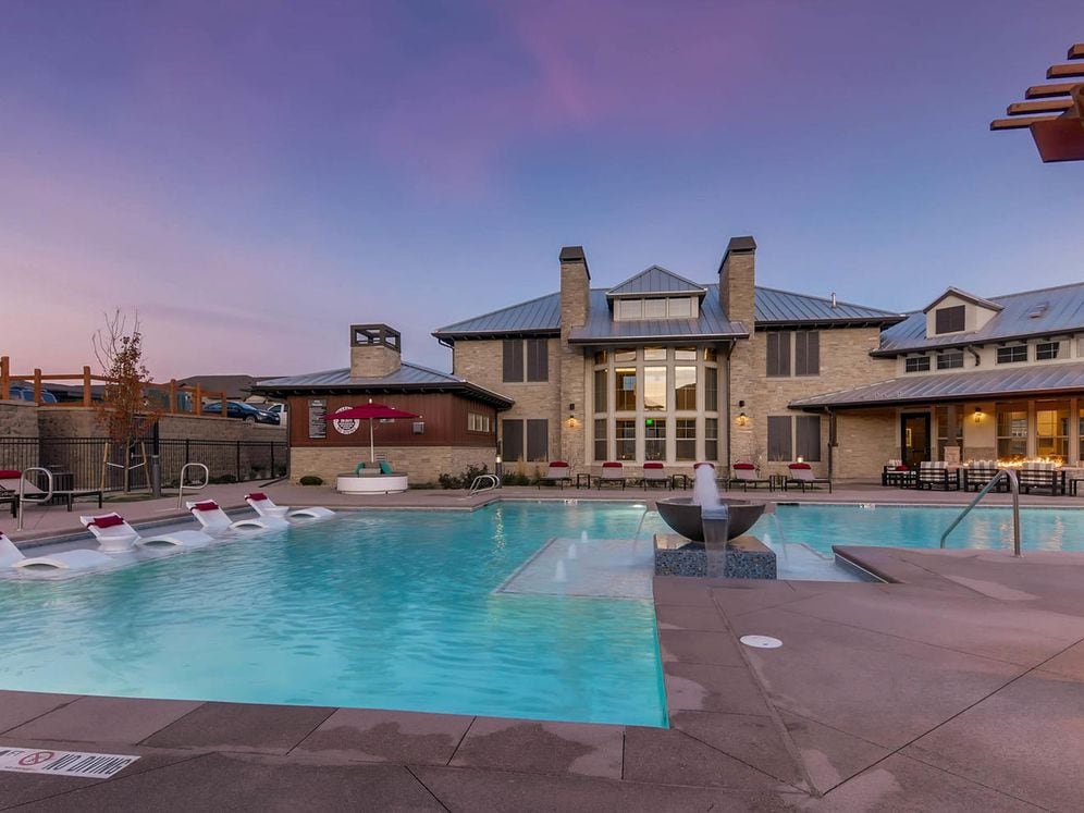 Swimming pool and sundeck with lounge seating