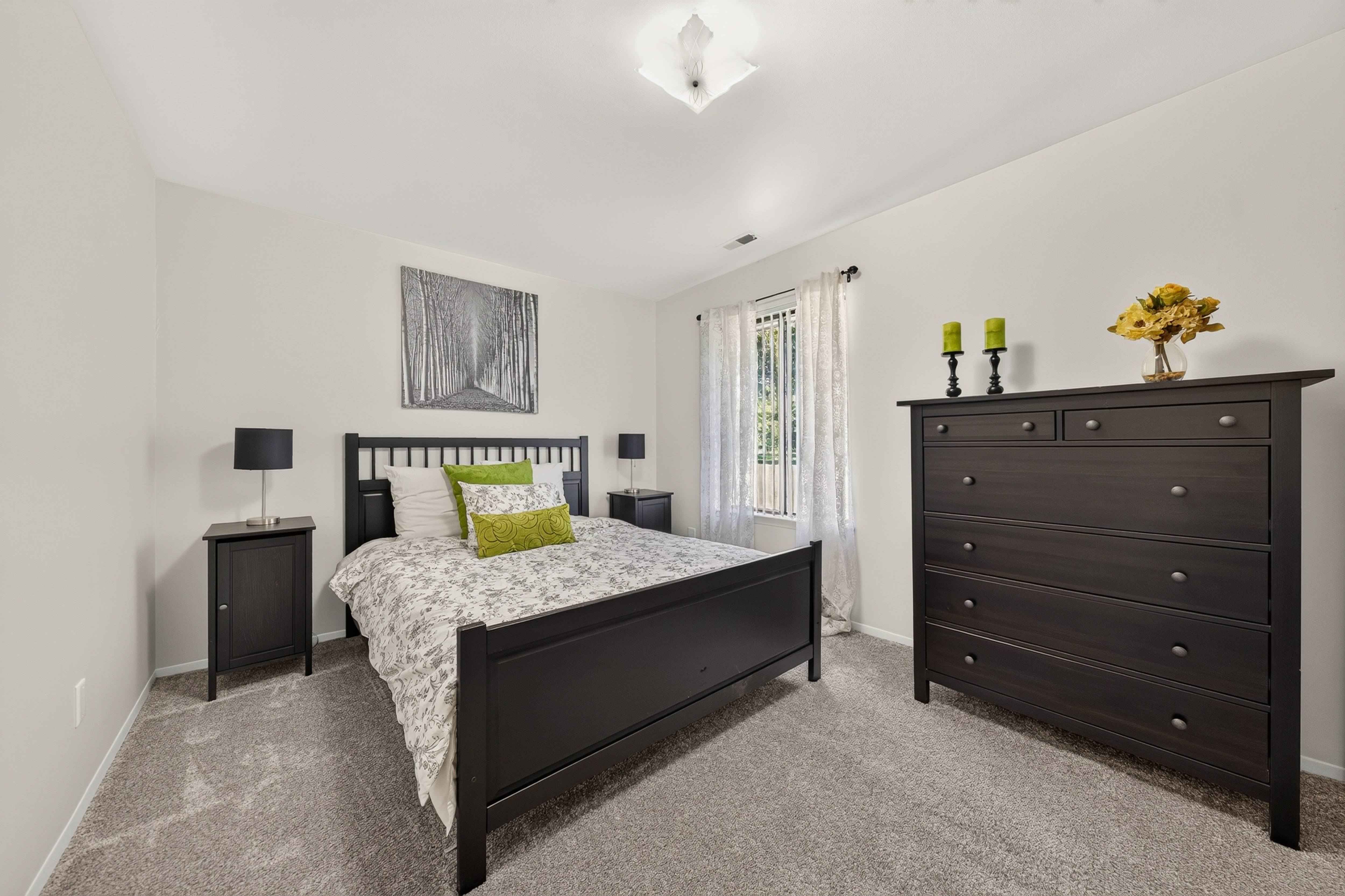 Modern bedroom with ample storage space at Eastwood Village Apartments in Clinton Township, MI.