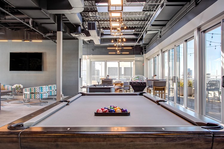 Rooftop club room with billiards, foosball, and bubble hockey in west loop
