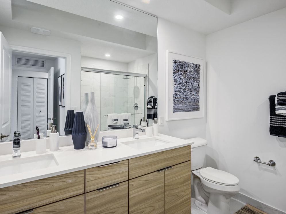 West Phase Bath with oak cabinetry, white countertop, and hard surface flooring