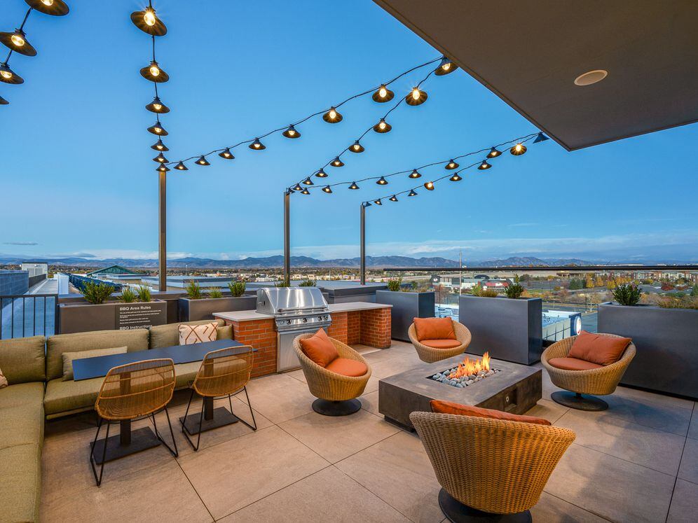 Rooftop lounge with fire pit and seating