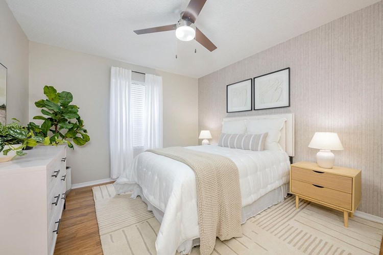 Spacious master bedrooms that will fit a king size bed, featuring a ceiling fan and walk-in closet.