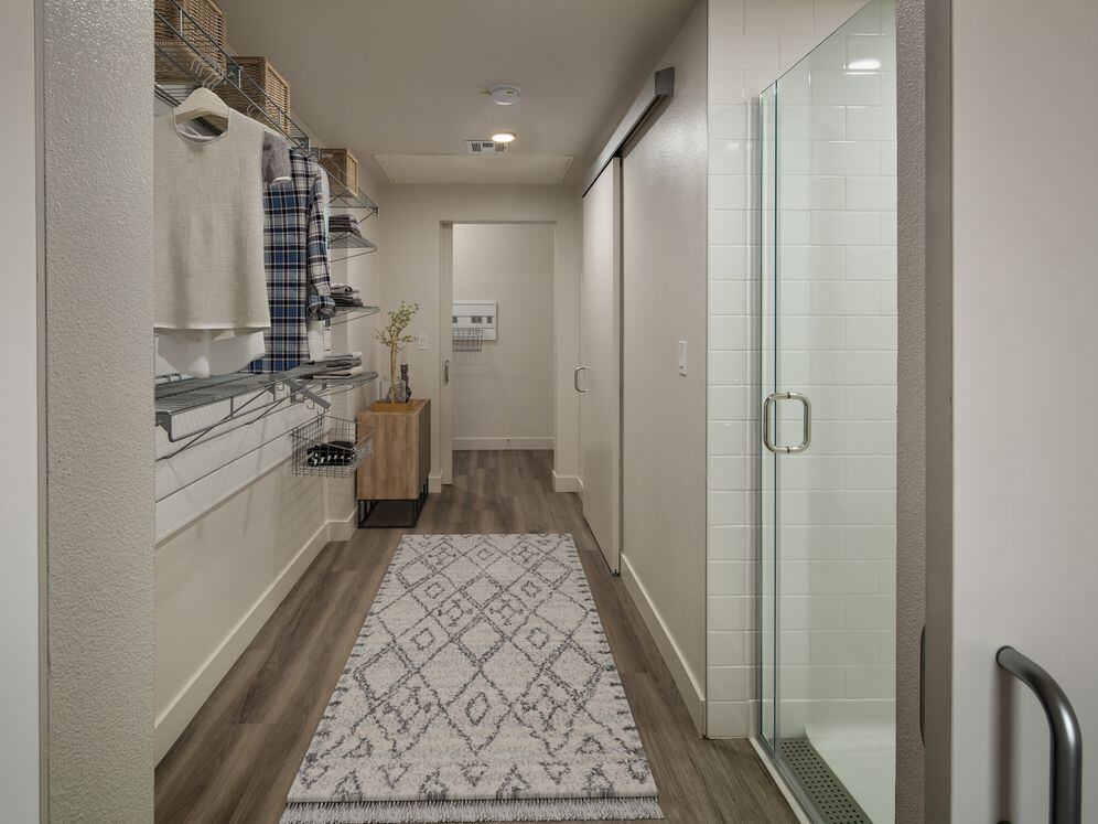 Finish Package I walk-through bath with standing shower and closet with gear wall