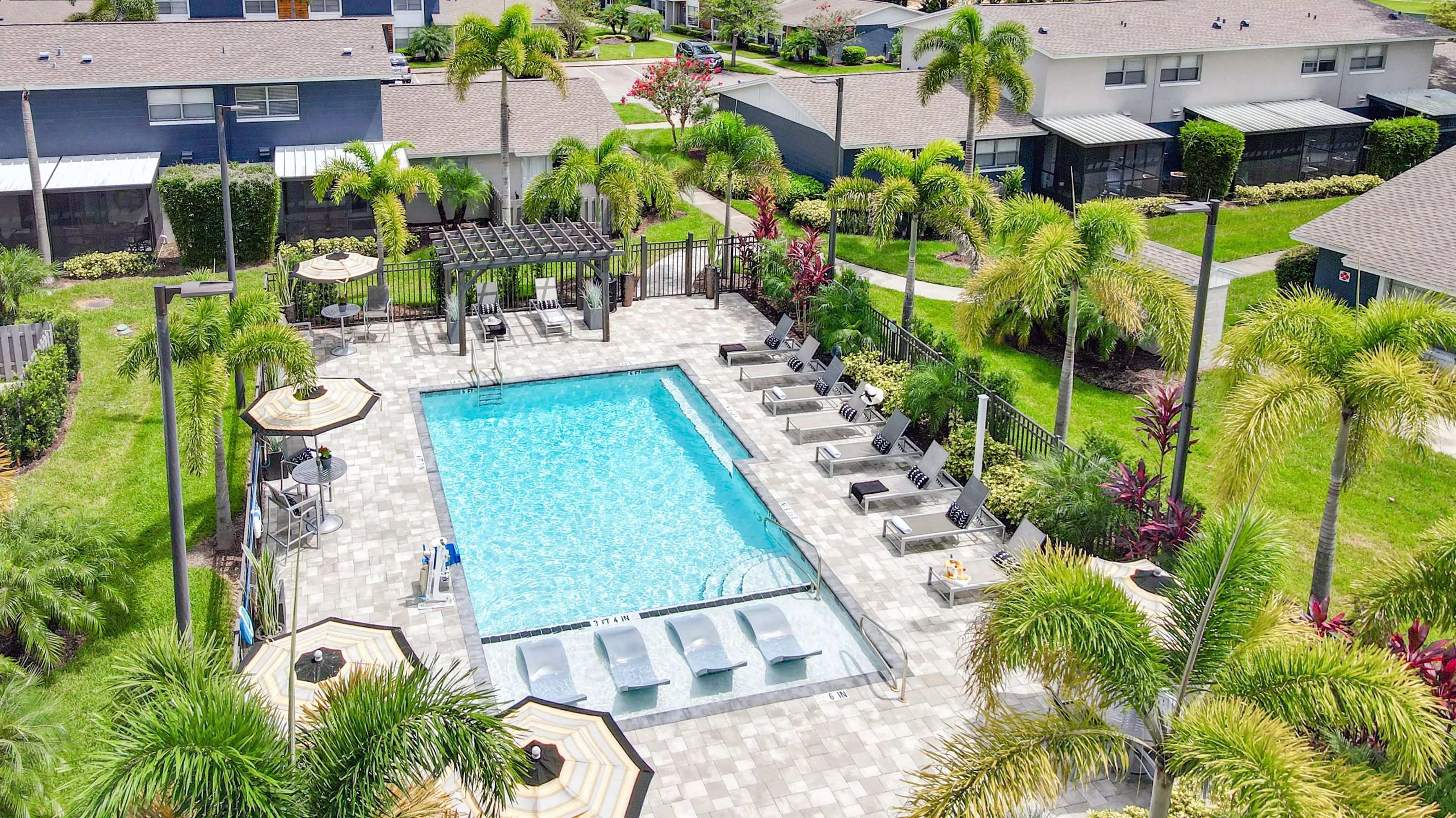 Lay back and soak in the sun on our spacious, beautifully paved sundeck by the sparkling pool. 