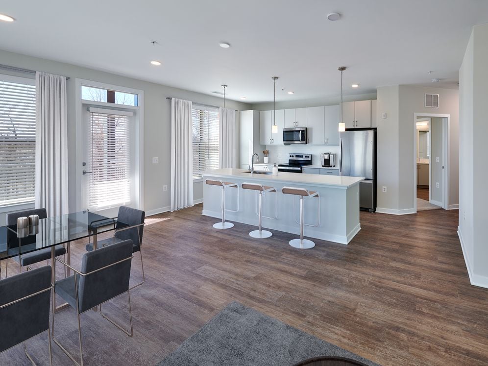 Design Collection I Kitchen, living, and dining areas with hard surface flooring throughout