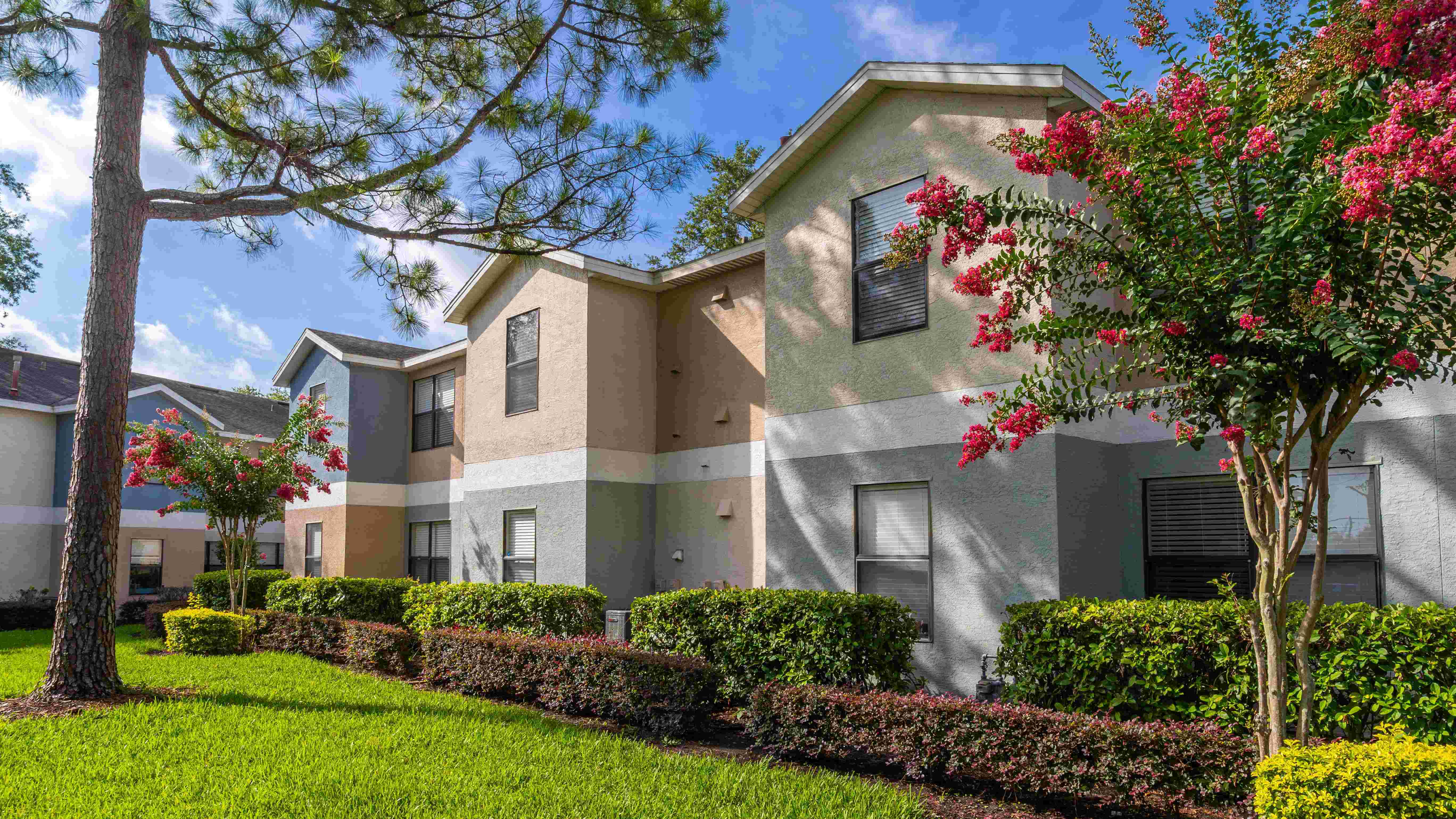 Enjoy the lush landscaping and charming curb appeal of Harper Grand Apartments in Orlando, FL. Our garden-style homes offer peaceful views and a welcoming atmosphere.