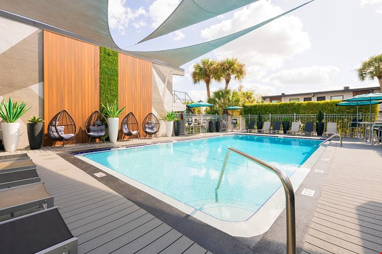 Lay out on our expansive sundeck, complete with loungers and tables with umbrellas.