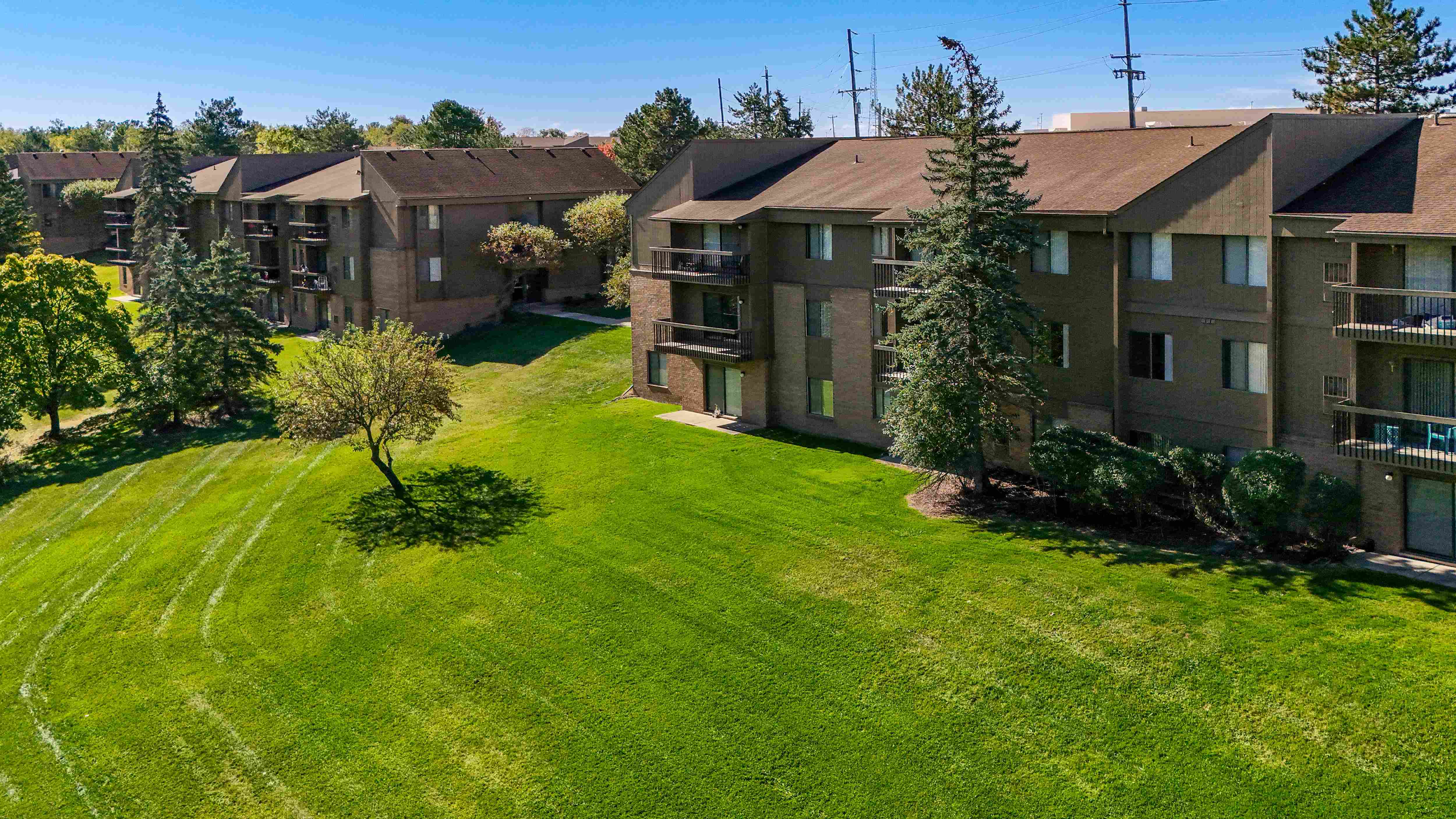 Expansive Green Space Apartment Building Exterior at Franklin River Apartments, Southfield, MI