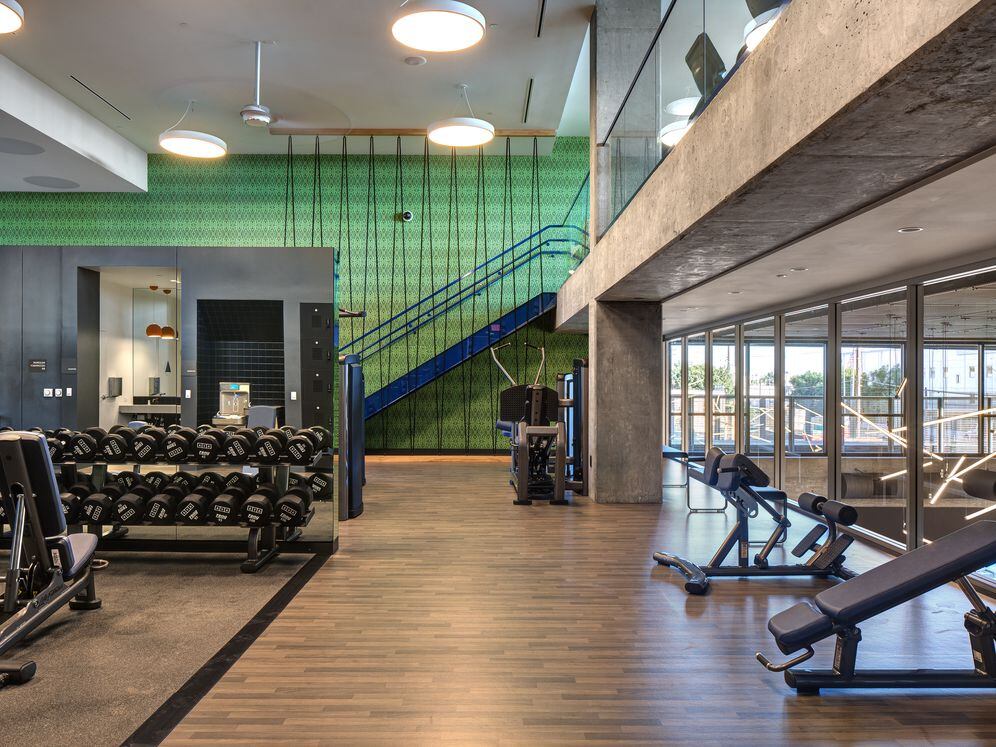Two-level fitness center with cardio and strength equipment