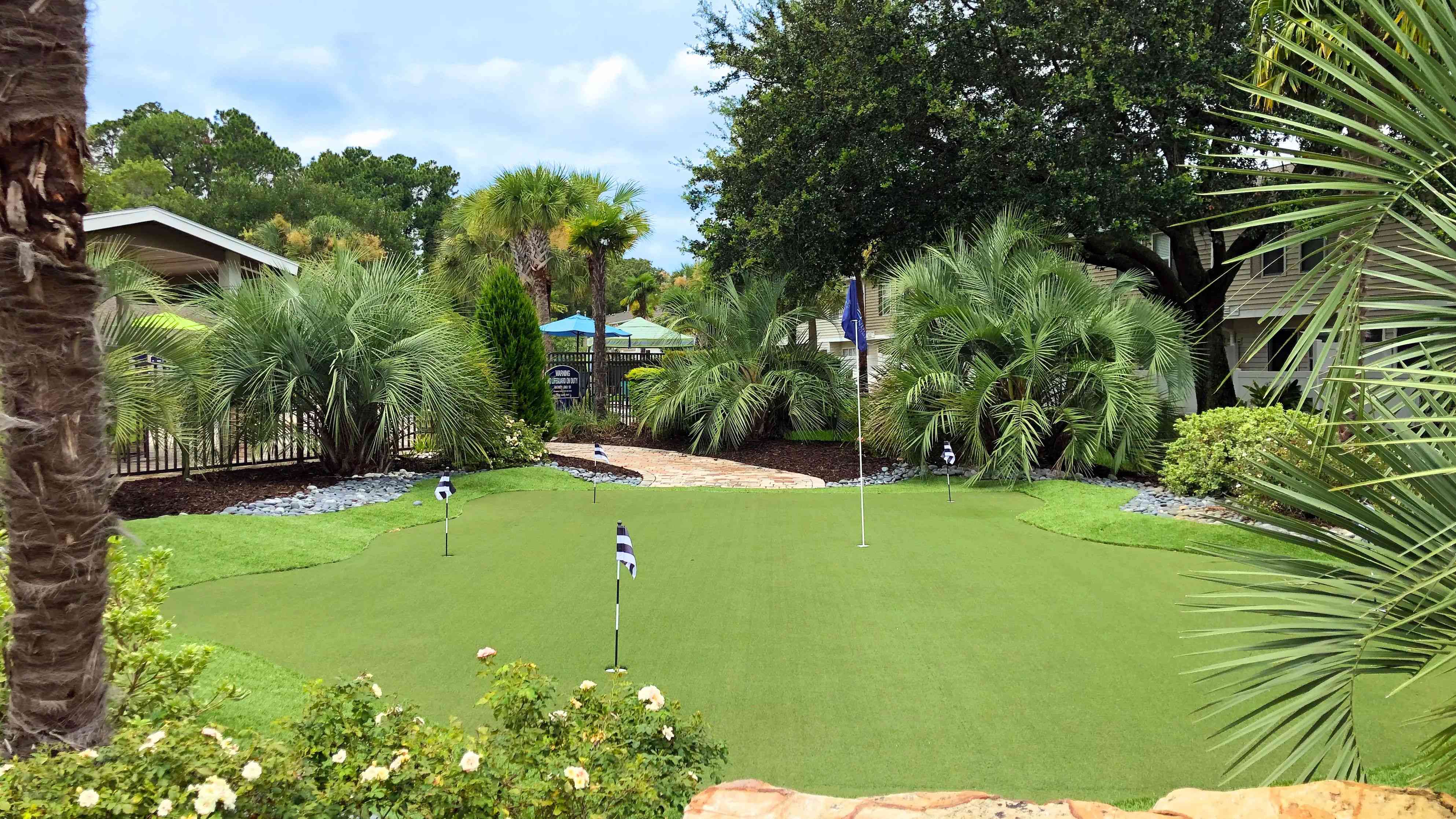 Indulge in putting practice at our serene on-site green paradise. Love where you live and moments like this to play steps from your front door.