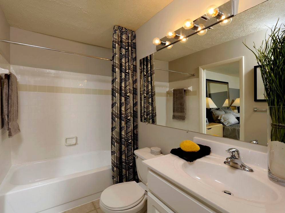 Classic Package II bath with white cabinetry, white countertop and hard surface flooring