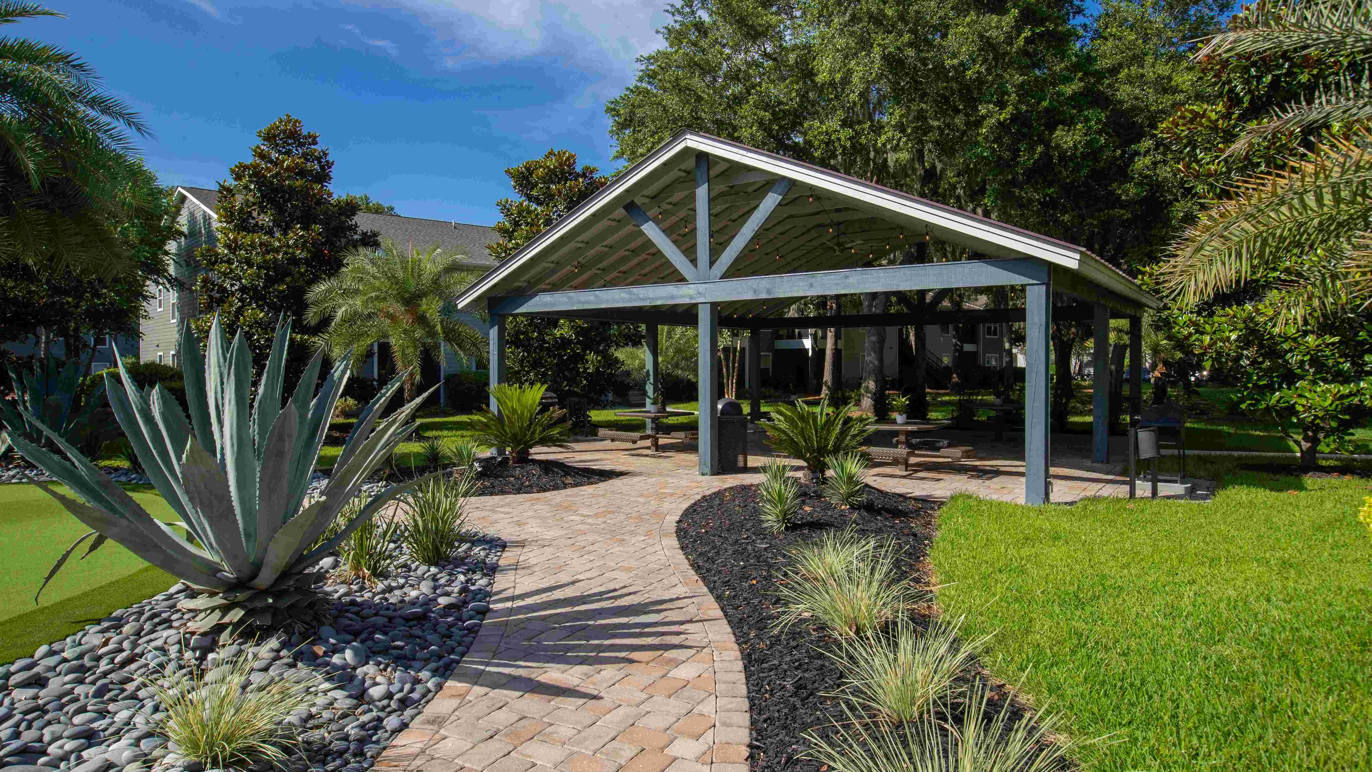 Follow the inviting paved pathway to the heart of relaxation at Emerson Isles—our pavilion.