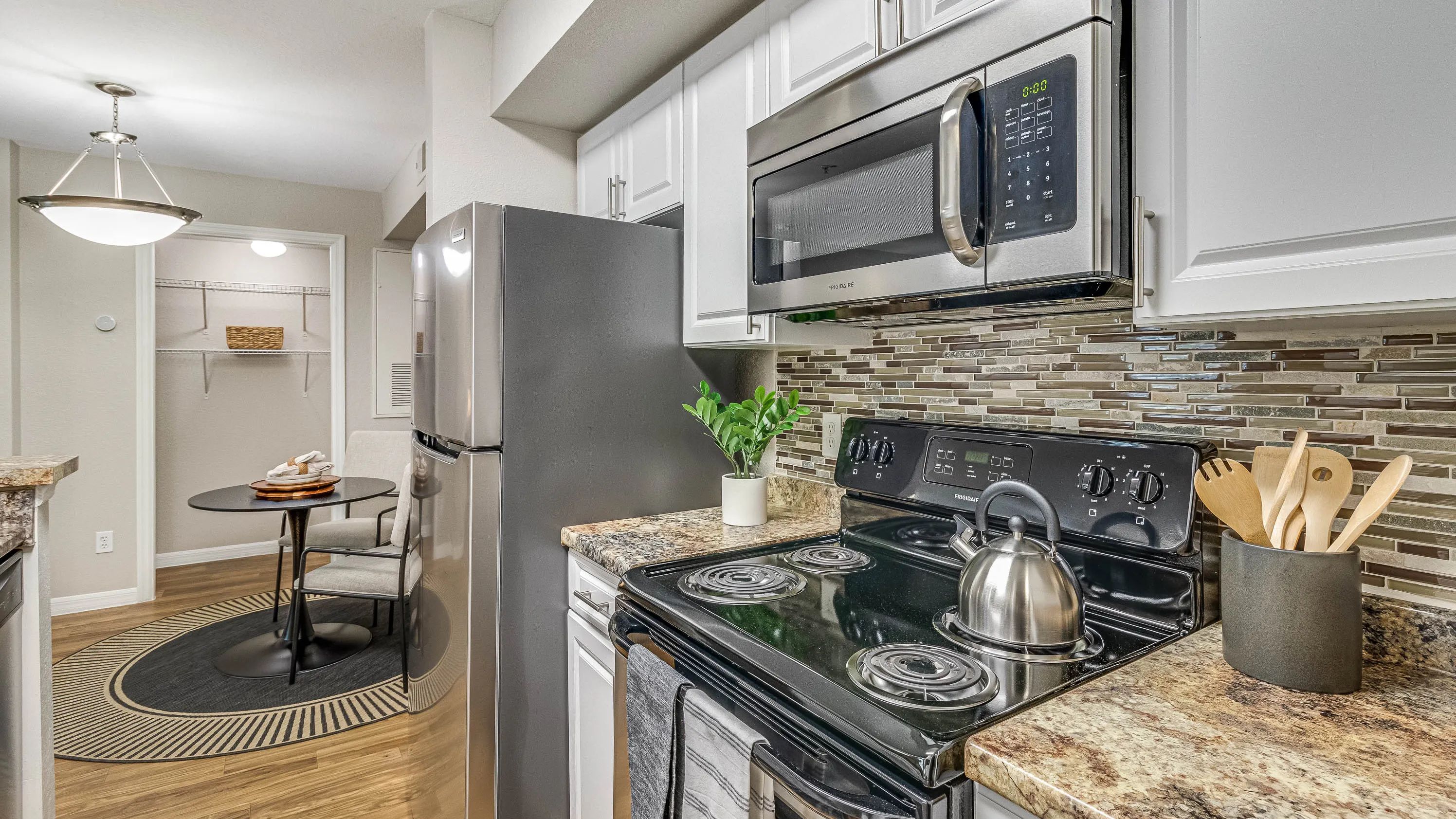 Enjoy our modern kitchens featuring granite-inspired countertops for all your culinary adventures!