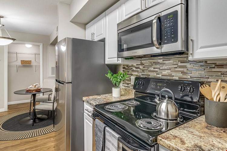 Enjoy our modern kitchens featuring granite-inspired countertops for all your culinary adventures!