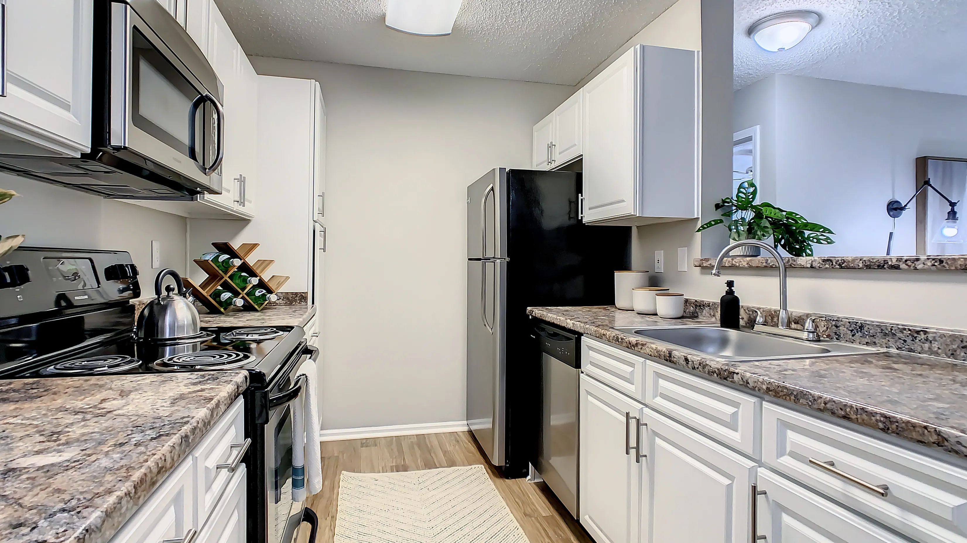 Unleash your inner chef in our chic, contemporary kitchens boasting ample space and modern style, a culinary canvas for exquisite flavors and unforgettable meals. 