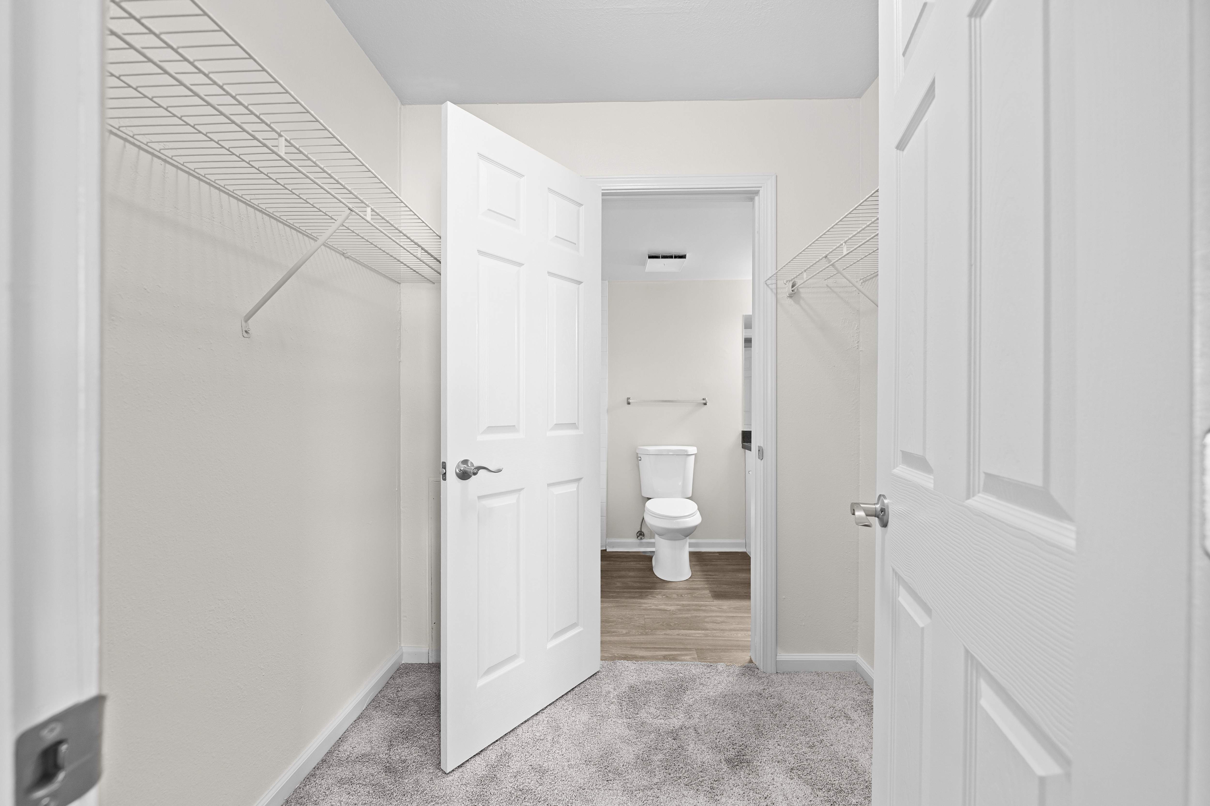 Bathroom with walk in closet at Three Oaks Apartments, Troy, Michigan