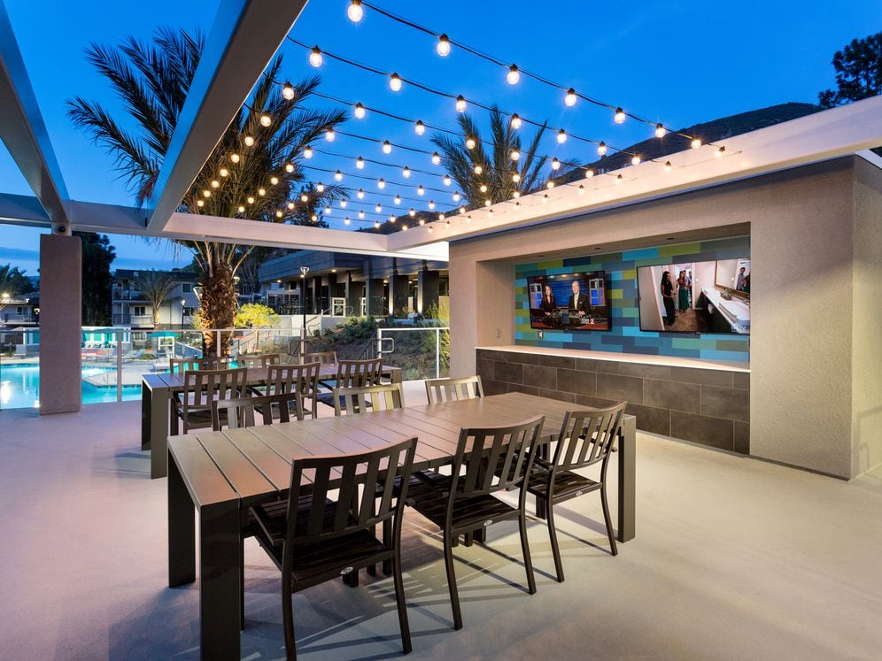 South Clubhouse sundeck with grills TVs and seating